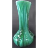 A Pilkington's Royal Lancastrian vase with drawn neck and marbled green glaze finish, with impressed