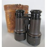 An unusual pair of leather bound binoculars with three settings to the lens 'marine', 'field' and '