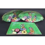 A pair of Carltonware art deco lustre wares in the Hollyhock pattern with green ground, comprising