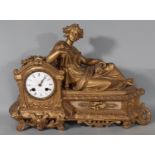 A 19th century gilded spelter mantel clock in the romantic style with eight day striking movement,