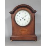 An inlaid Edwardian mahogany mantel clock with string inlay and other detail, with enamelled