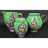A collection of Carltonware art deco lustre wares in the Hollyhocks pattern, all with green ground