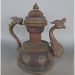 A Tibetan copper teapot with dragon handle and spout, 25 cm high