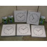 Five unused boxed 12" silent night wall clocks together with three further unused Dymo junior