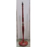 An Edwardian/1920s wooden standard lamp, the turned stem and circular platform base with all over