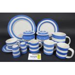 An extensive collection of TG Green Pottery Cloverleaf blue and white banded Cornish kitchen wares