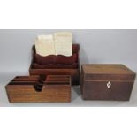 Two mahogany letter racks and a tea caddy box and some vellum manuscripts (AF)