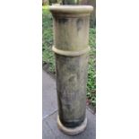 A tall reclaimed buff coloured chimney pot of cylindrical form 121 cm high