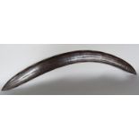 An antique Indigenous Aboriginal Mulga wood boomerang with incised decoration. 63cm