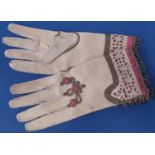 Vintage pair of child's gloves in fine suede, embellished with goldwork and cutwork, length 14cm