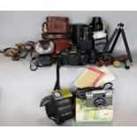 Photographic Equipment: A Minolta X-700 camera, an Optima camera, a Sigma 600mm zoom lens, flash