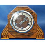 An art deco mantle clock, the case principally in oak with additional inlaid detail enclosing a