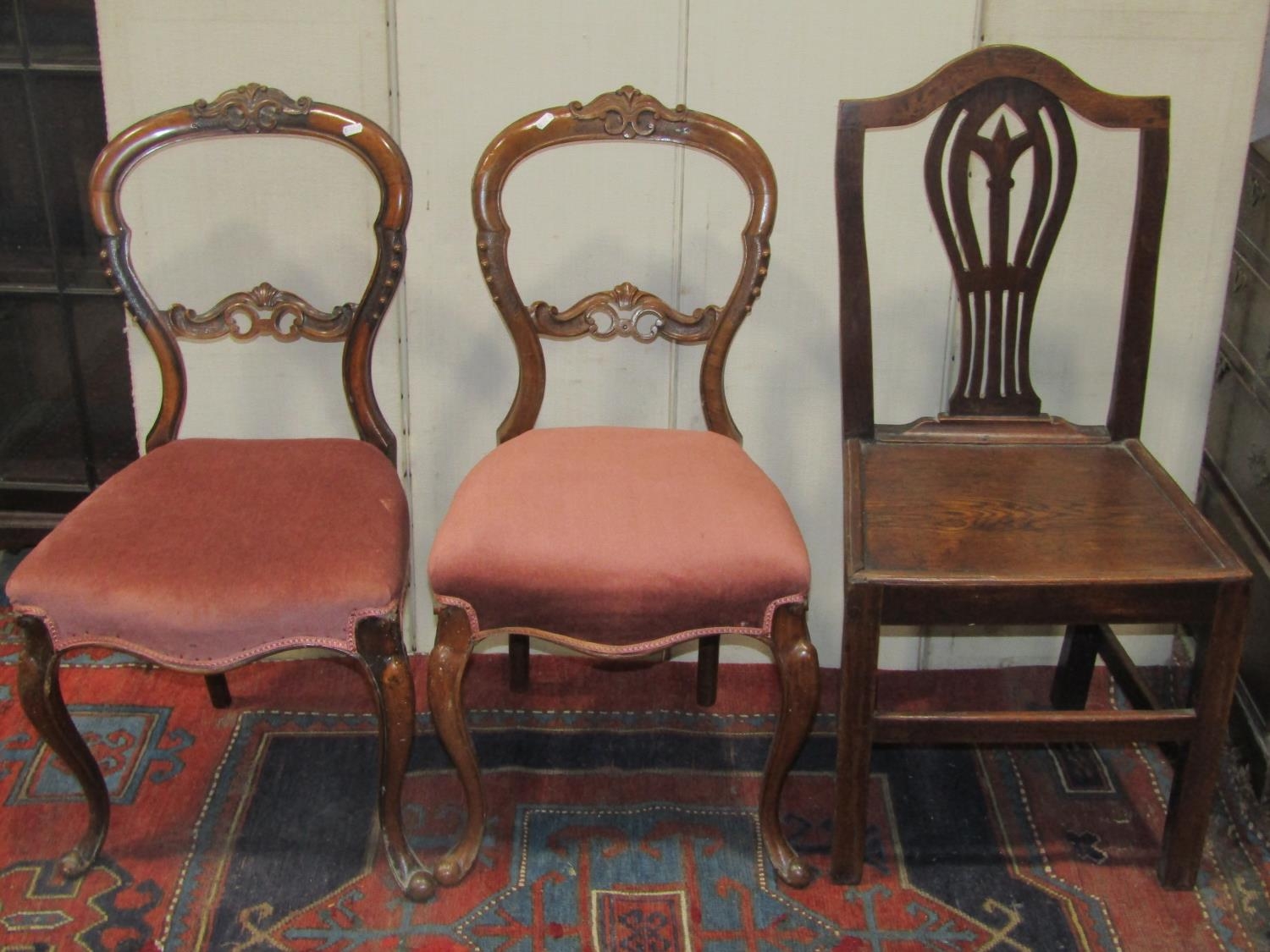 Two Lancashire style wavy ladderback open armchairs with rush seats together with a pair of