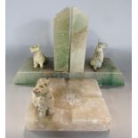 A pair of Art Deco marble bookends with White West Highland Terrier mounts and an ash tray to
