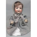 Early 20th century bisque head character doll by Kammer & Rheinhardt with 5 piece bent limb