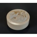 19th century ivory box and cover, the lid with carved detail showing a girl, her hair in ringlets