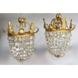 A pair of gold painted glass bag chandeliers and a single brass glass bag chandelier. 3