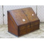 A Victorian walnut and figured walnut veneered stationery cabinet enclosed by two doors, with