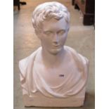A plaster bust of a classical male head monogramed SMC, 58cm high