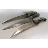 Two antique double bladed daggers of simple design, and a single bladed knife. 3