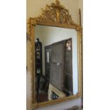 An 18th century style mirror of rectangular form with repeating Geometric border, to the arch a