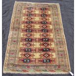 A Turkoman rug with repeating geometric design on a pale cream ground, 190 x 135cm