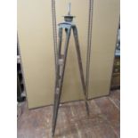 Three vintage timber and metal mounted tripods, various sizes, ages and gauges