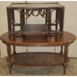 A reproduction two tier occasional table of oval form with moulded outline together with a further