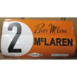 A reproduction McLaren racing car panel, No2 - Bruce McLaren - Goodyear, Reynolds Aluminium Produced