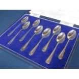 A cased set of eight Mappin & Webb teaspoons, pairs bearing the floral emblems of the UK,