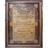 An early 20th century fretwork panel with the Lord's Prayer, mounted on velvet and in an oak moulded