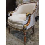 A reproduction regency style upholstered tub chair with showwood frame, rams head detail and