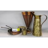 A collection of copper and brassware including a copper umbrella stand, kettle, a brass pitcher,