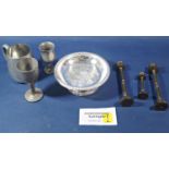 A mixed quantity of pewter tankards and goblets, brass candlesticks. (collection)