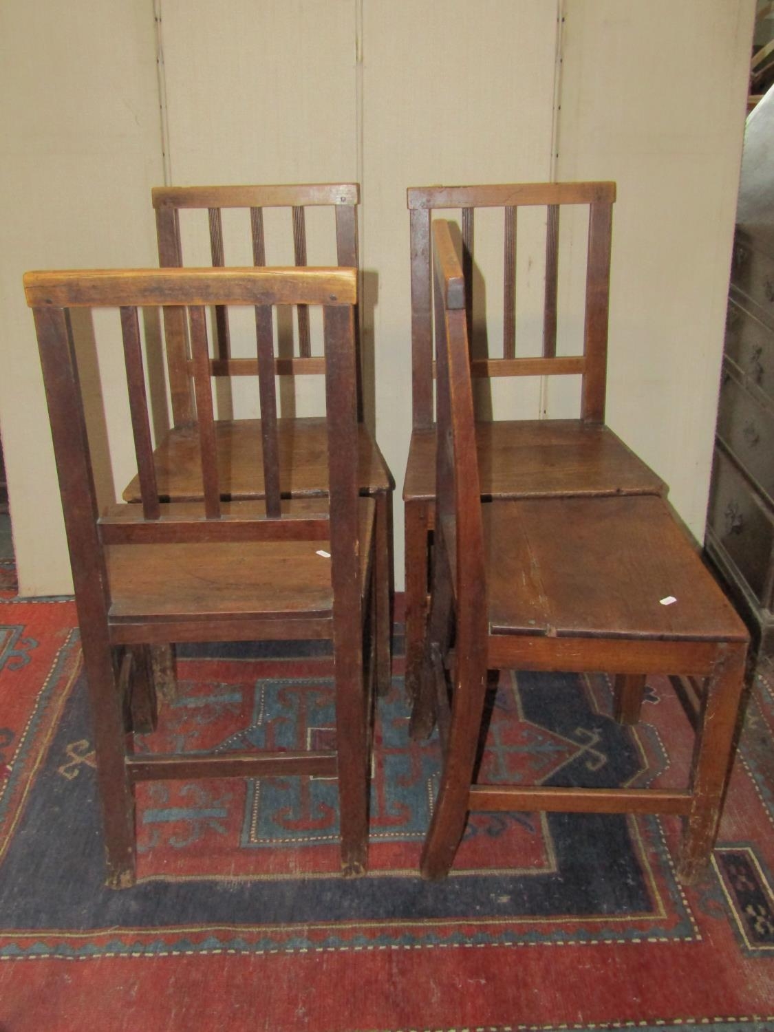 A set of four Georgian country made dining chairs with reeded stick backs over solid seats and - Image 2 of 2