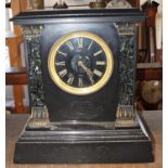 A mid-Victorian period black slate and marble mantle clock with eight day striking movement, key and