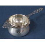 A silver tea strainer on stand, Birmingham 1937, by Barker Brothers, 2.5oz