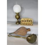 A brass Duplex oil lamp with a white opaque shade, a brass skimmer, a pair of leather bellows and