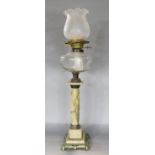 A 19th century marble classical column style oil lamp. 66cm high (lacks chimney)