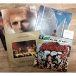 A collection of mixed vinyl LPs to include The Beatles, David Bowie, Yes, Led Zeppelin,