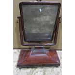 A 19th century mahogany toilet mirror, with rectangular plate, within a cradle shaped frame,