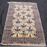 A Yamut rug with an overall floral motif on a fawn ground with running floral borders, 195 x 140cm