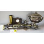 A miscellaneous collection of items, including an electric samovar, tie press, a souvenir