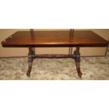 A low mahogany occasional table on Regency swept supports