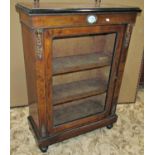 A Victorian walnut and figured walnut veneered pier cabinet, enclosed by a rectangular glazed