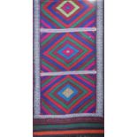 An old Suzni Kelim runner with three red, green and blue concentric diamond patterns, 267cm x 65cm