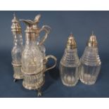 A Victorian silver cruet stand of three cut glass bottles with silver necks and a pair of silver