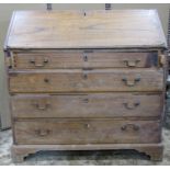 A Georgian oak country made bureau, the fall flap enclosing a fitted interior of small drawers,