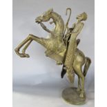 A bronze statue of an Ethiopian noble man riding a rearing horse. 44.5cm high.