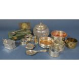 A mixed variety of silver to include six napkin rings, two coasters, a boxed set of spoons and a